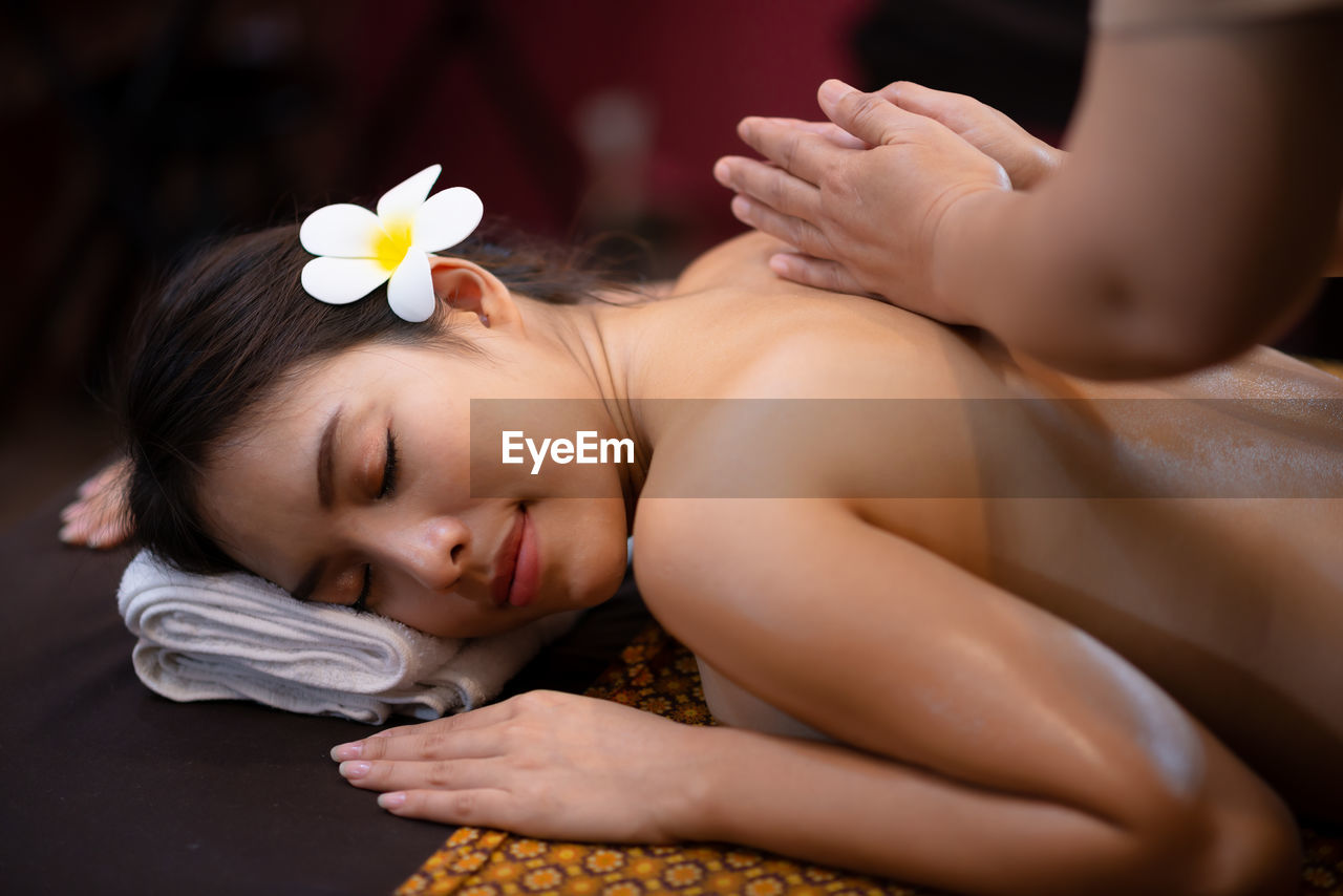 Young beautiful asian woman relax massage in spa salon
