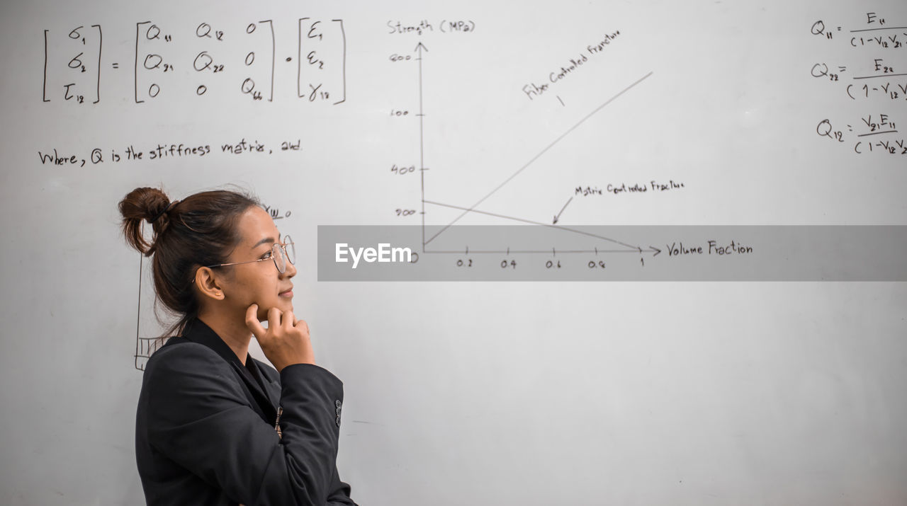 Teacher is teaching physics to students during the new school days after a long break