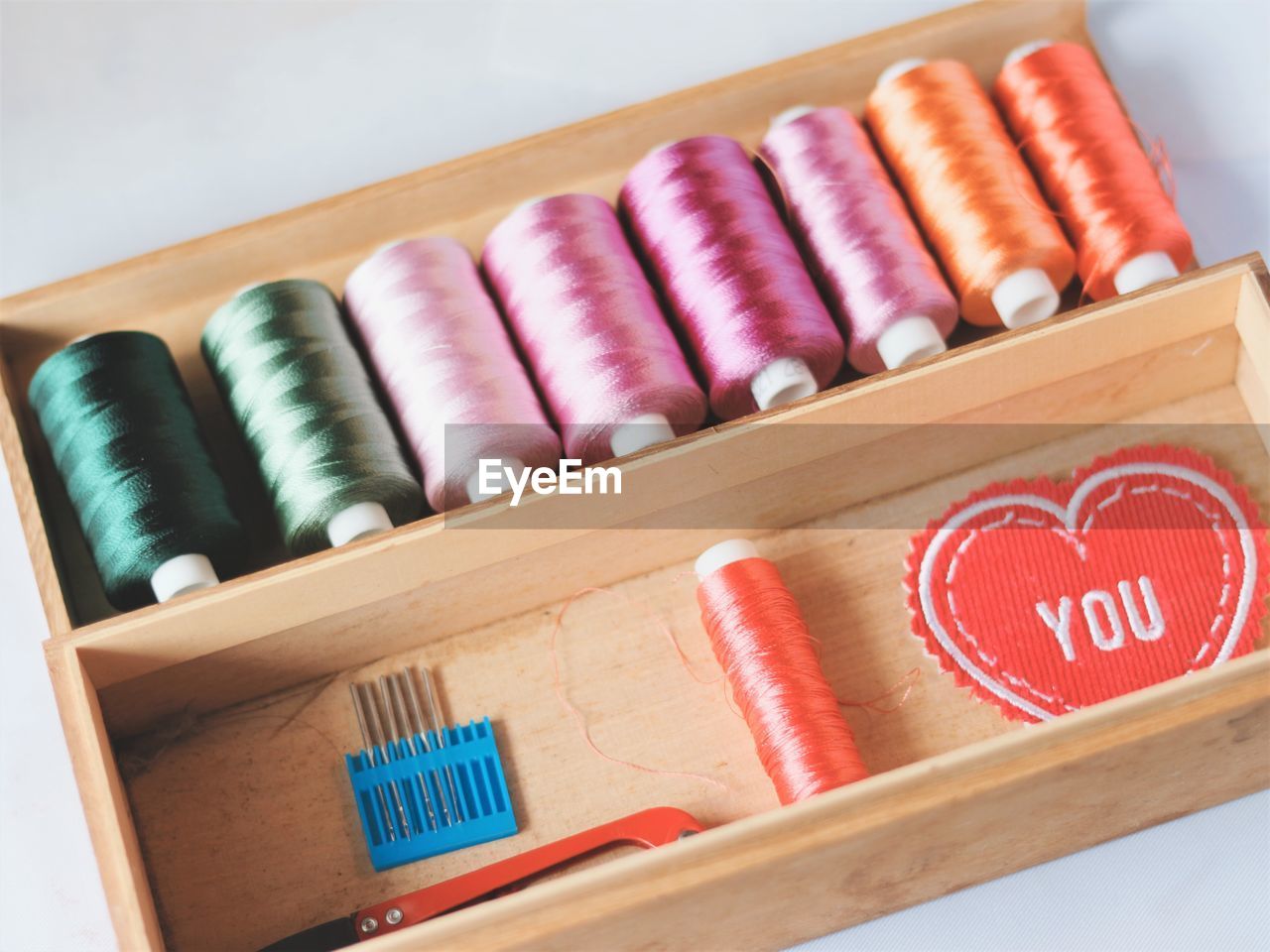 High angle view of multi colored sewing items on table