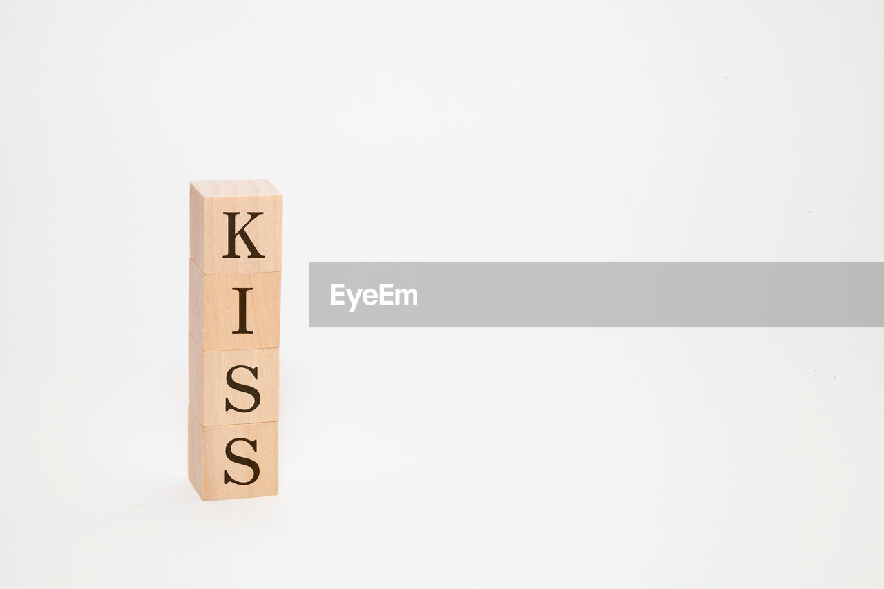 studio shot, text, indoors, copy space, number, communication, white background, no people, font, western script, close-up