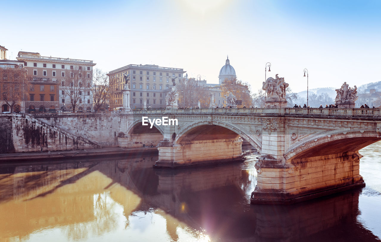 Ponte sant angelo over tiber river by st peter basilica