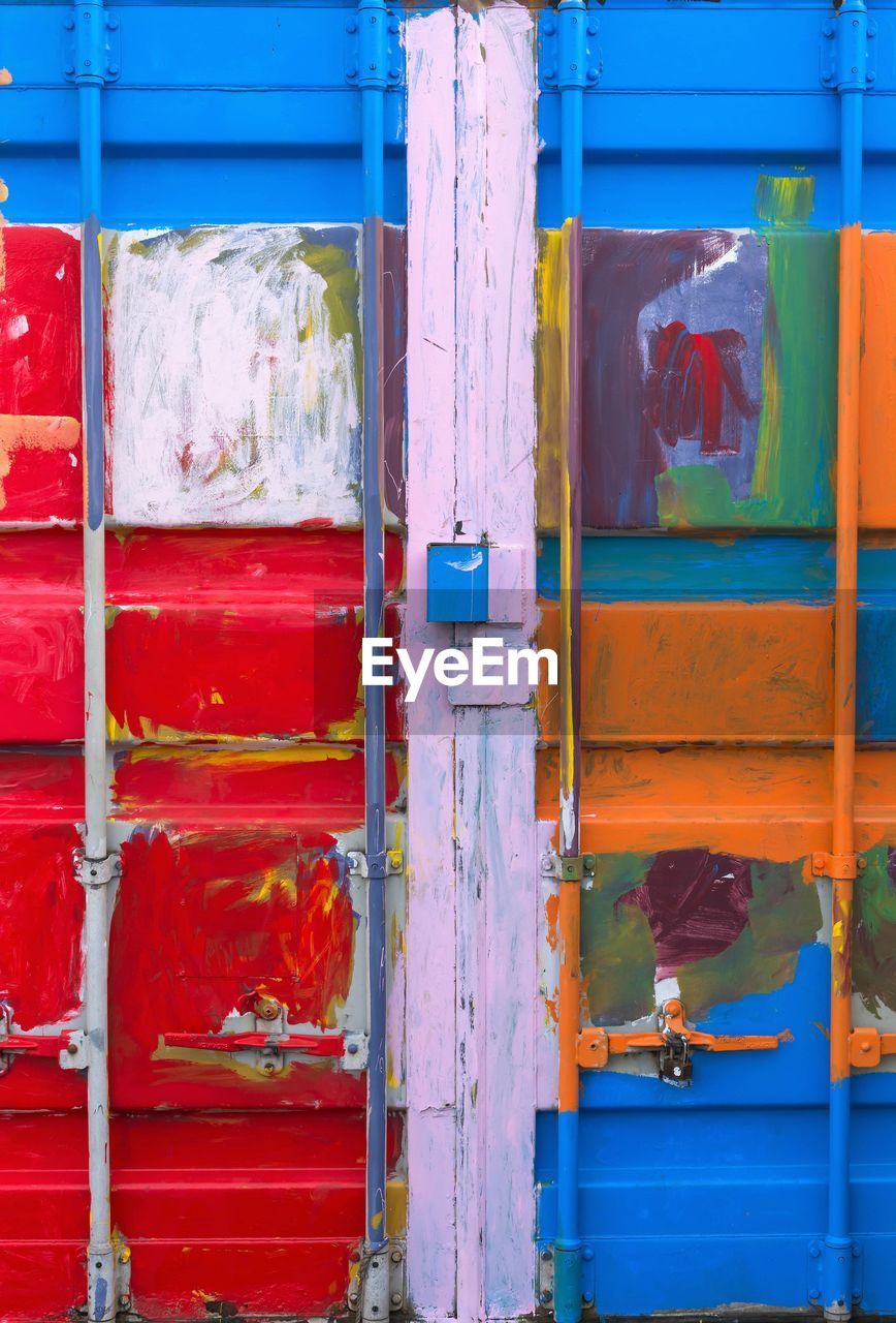 Full frame shot of multi colored door of shipping container