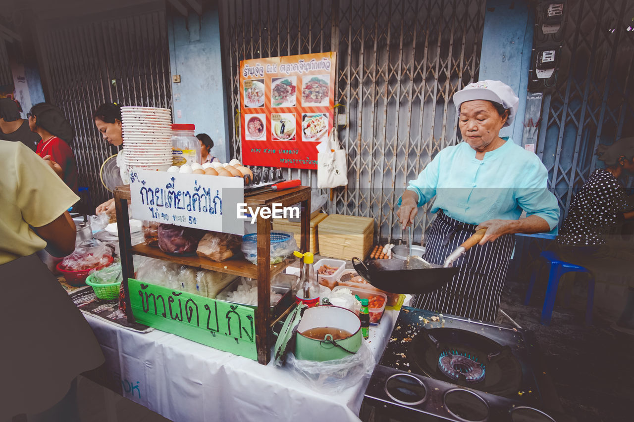 MAN FOR SALE IN MARKET STALL