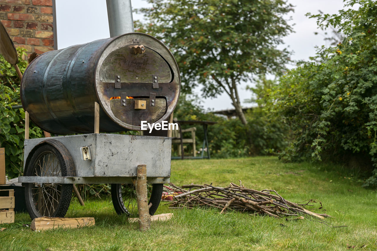 plant, tree, nature, day, grass, no people, outdoors, farm, history, old, the past, vehicle, metal, cannon, architecture, land, field, green, rural area, rusty