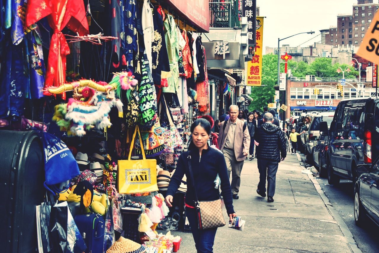 PEOPLE ON STREET MARKET IN CITY