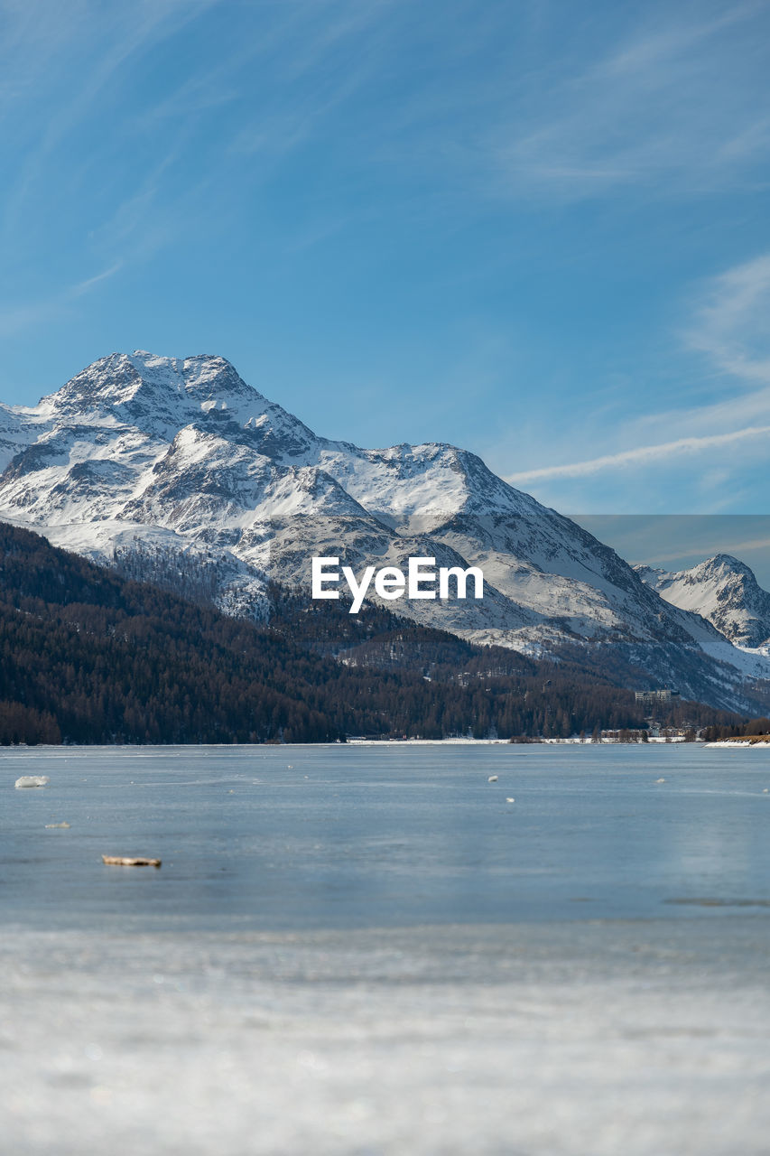 Switzerland, february 21, 2023 panorama with the lake of silvaplana and the mount corvatsch 