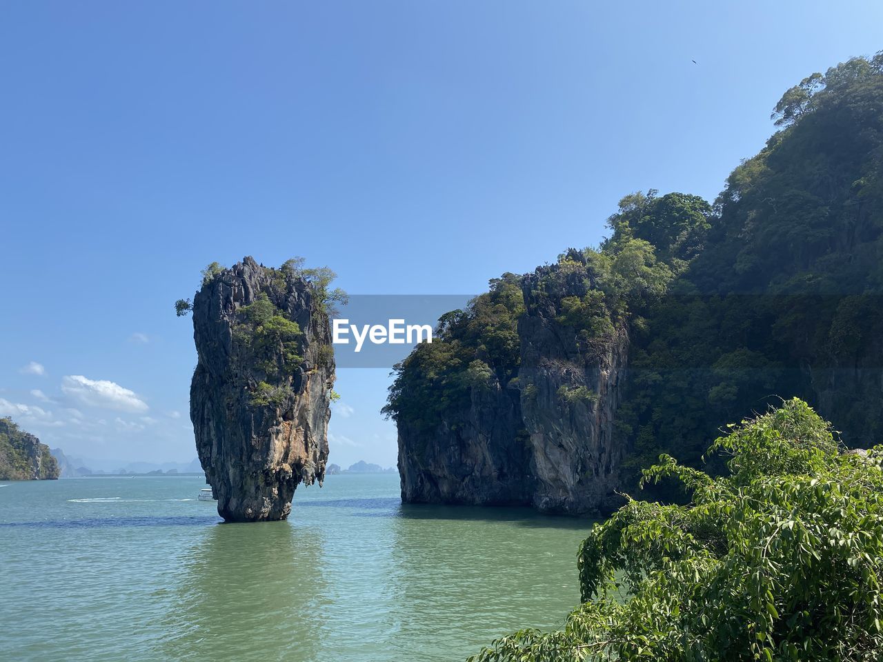 Scenic view of rock formation in sea against sky