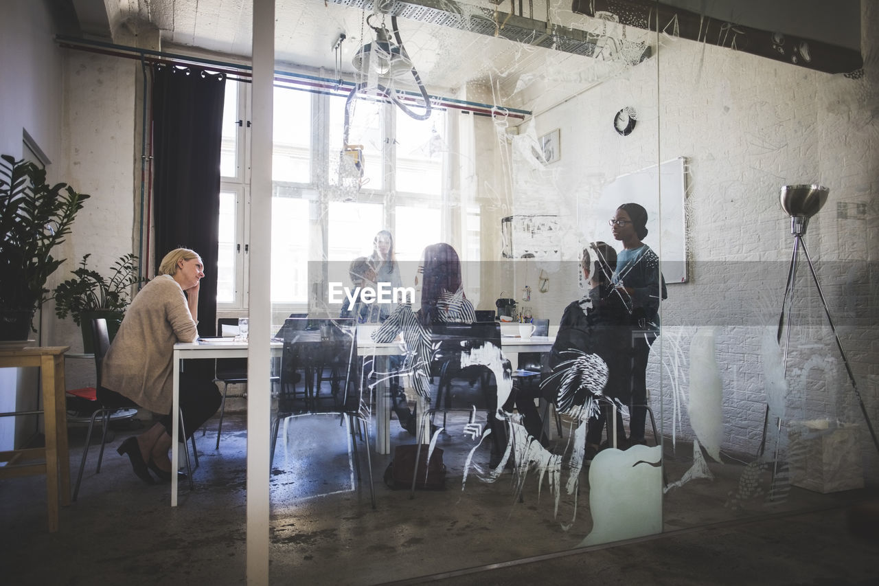 Business people in board room during brainstorming session