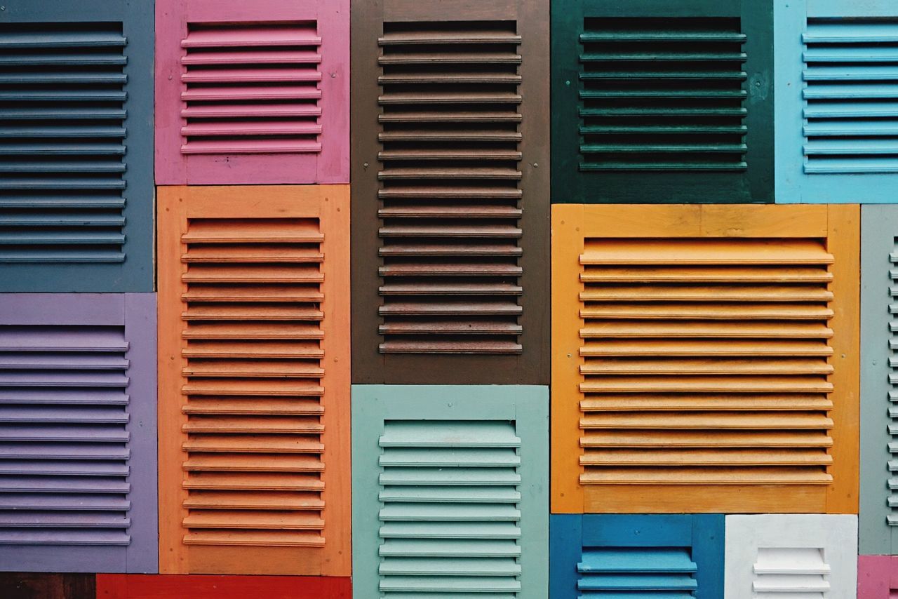 Full frame shot of colorful window shutters