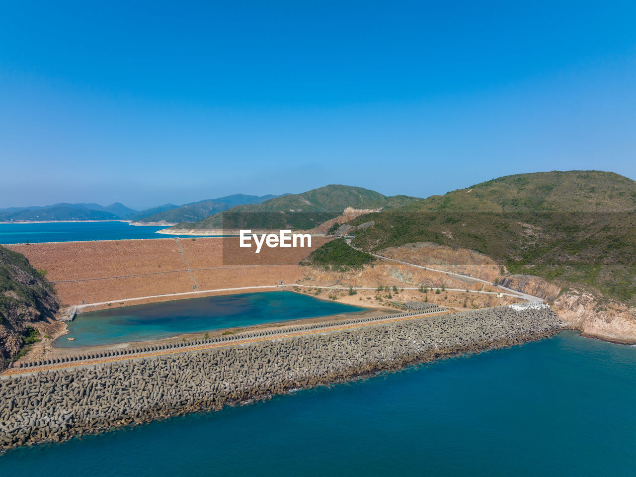 high angle view of sea against clear blue sky