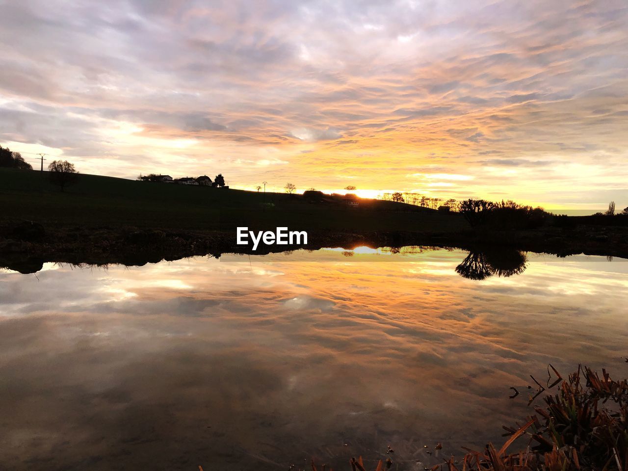 LAKE AGAINST SKY DURING SUNSET