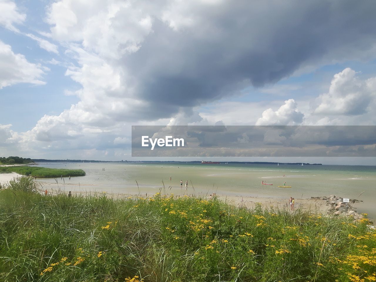 Scenic view of sea against cloudy sky