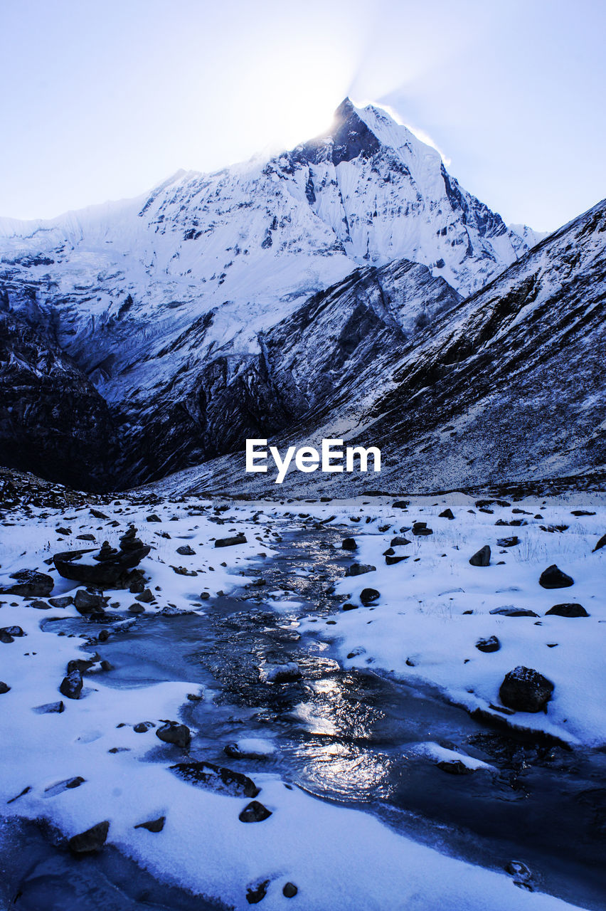 View of the nepalese mountains and river at sunrise. mountain winter landscape. annapurna base camp.