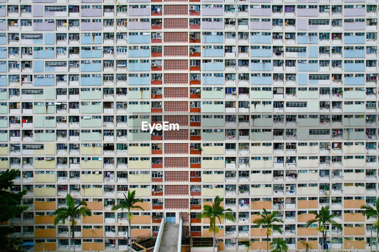 Full frame shot of the famous residential building with rainbow colour in hong kong