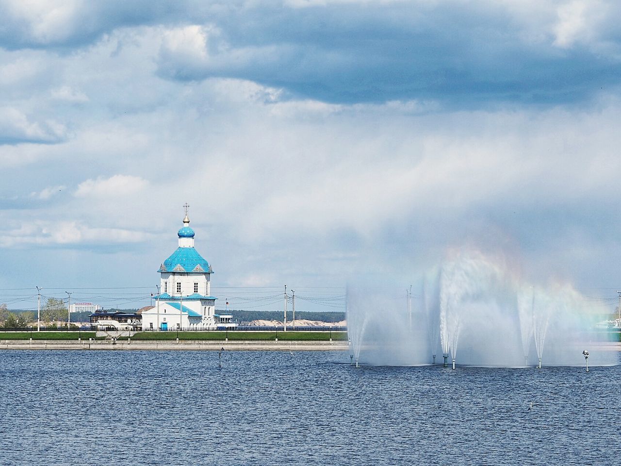 SEA BY BUILDING AGAINST SKY