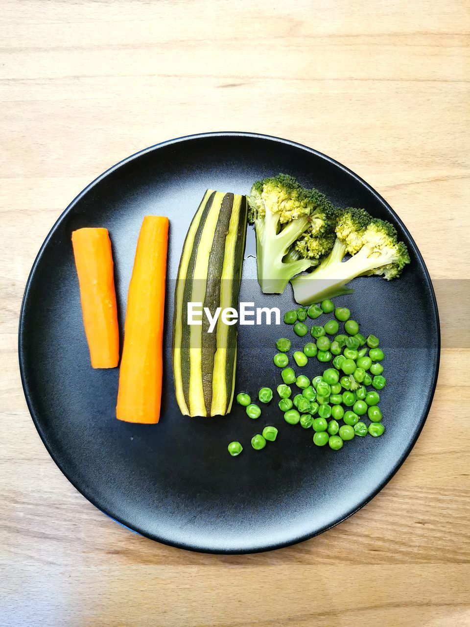 food and drink, food, healthy eating, wellbeing, freshness, vegetable, indoors, wood, directly above, table, high angle view, no people, studio shot, produce, raw food, root vegetable, still life, carrot, plate, fruit, organic, vegetarian food, bowl, cucumber, green, zucchini