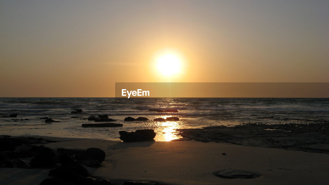 Scenic view of sea against sky during sunset