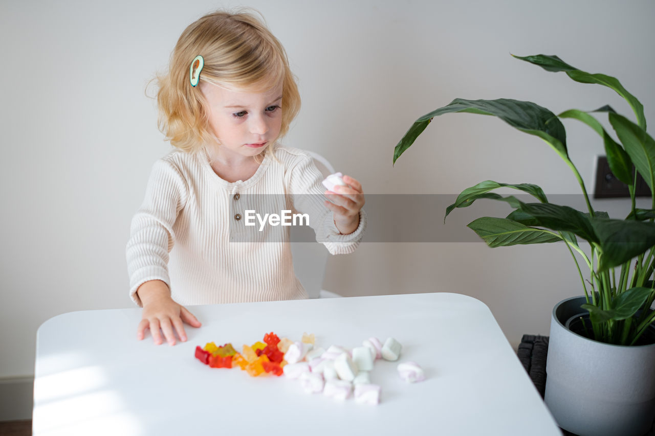 portrait of cute girl having breakfast