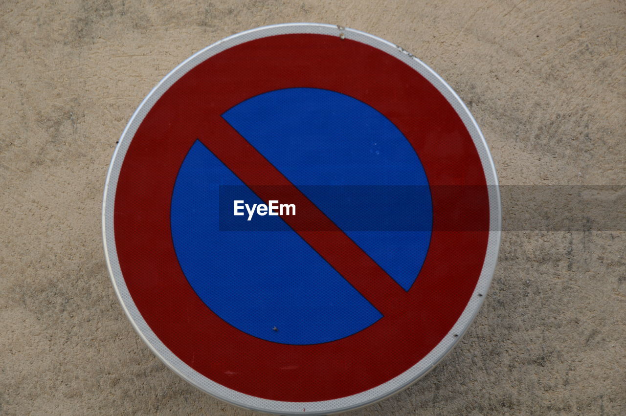 red, circle, sign, geometric shape, traffic sign, shape, communication, number, warning sign, road, road sign, forbidden, no people, blue, font, guidance, day, information sign, close-up, trademark, signage