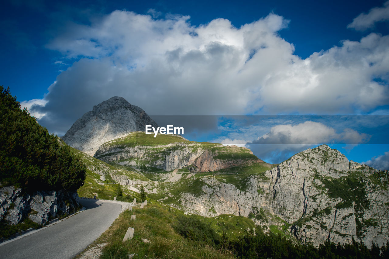 Scenic view of mountains against cloudy sky