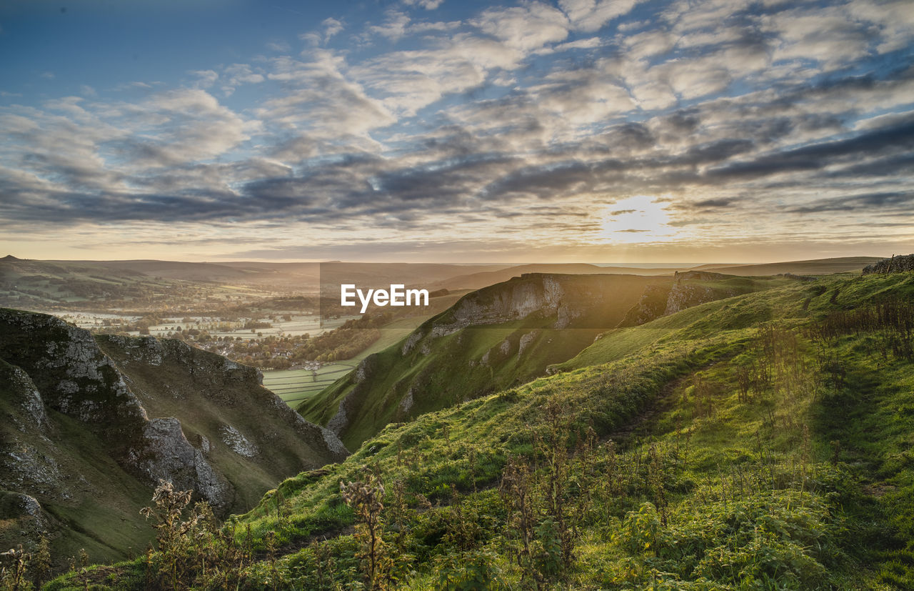 Scenic view of landscape against sky during sunset