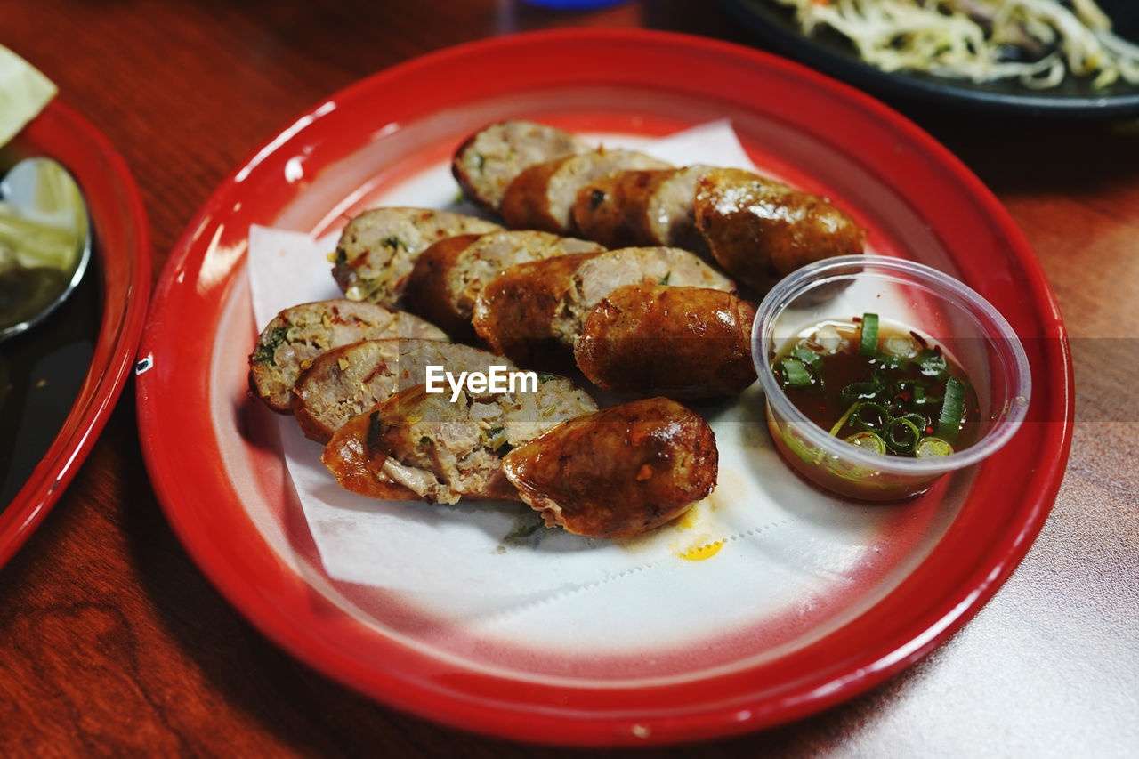 food, food and drink, plate, healthy eating, dish, freshness, table, fast food, wellbeing, cuisine, no people, vegetable, asian food, meat, meal, indoors, produce, seafood, serving size, fried, close-up, savory food, still life, condiment, focus on foreground