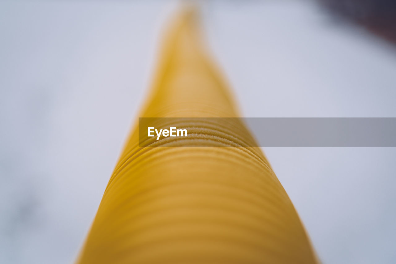 Close-up low angle view of yellow tube
