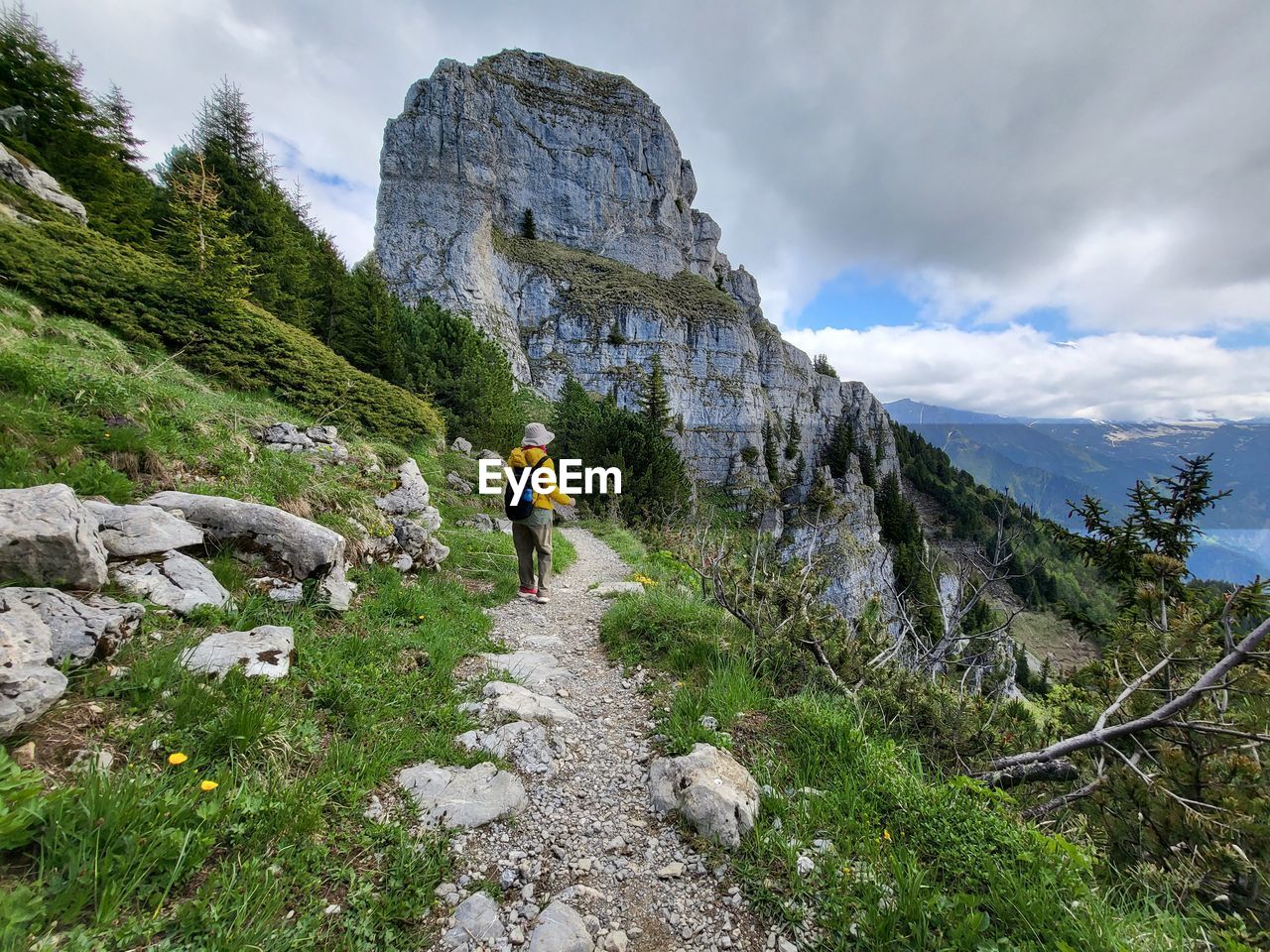 rear view of man walking on mountain