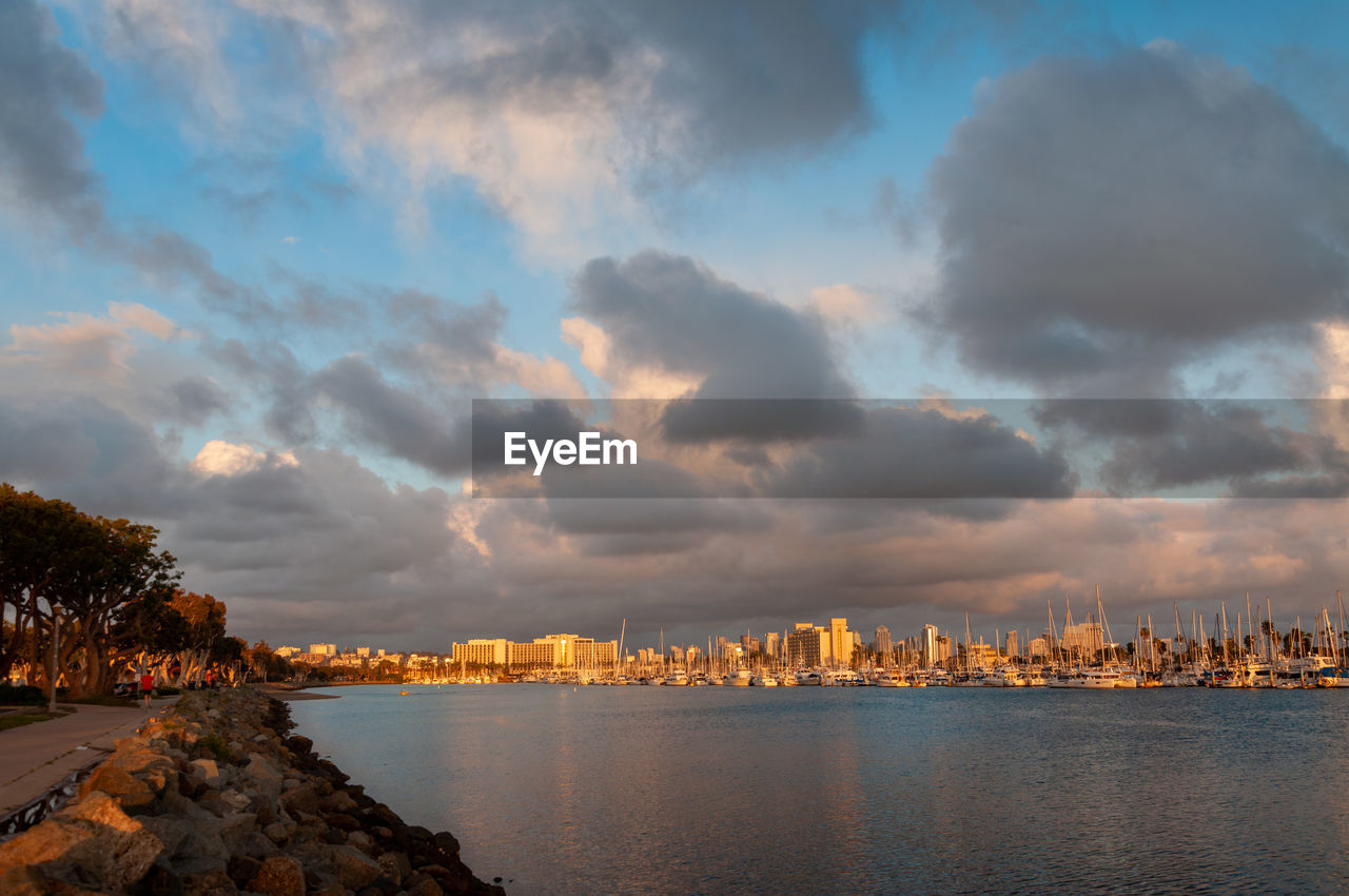 Panoramic view of sea and buildings against sky