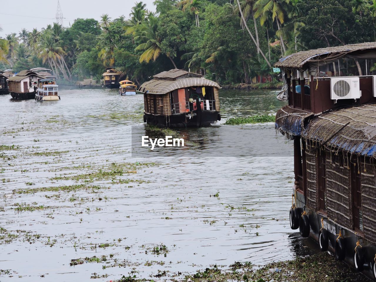 Scenic view of river, boat house  alappuzha