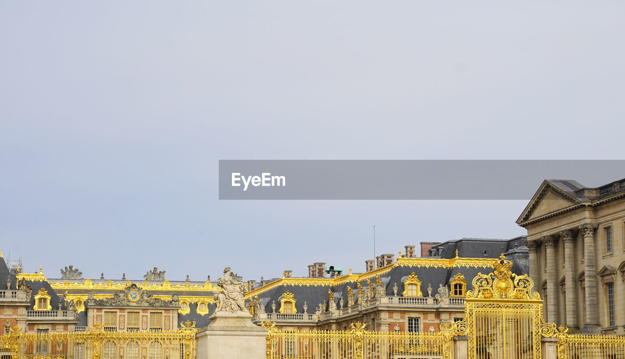 Low angle view of buildings against clear sky