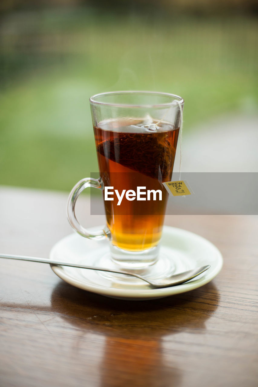 Close-up of tea on table against window