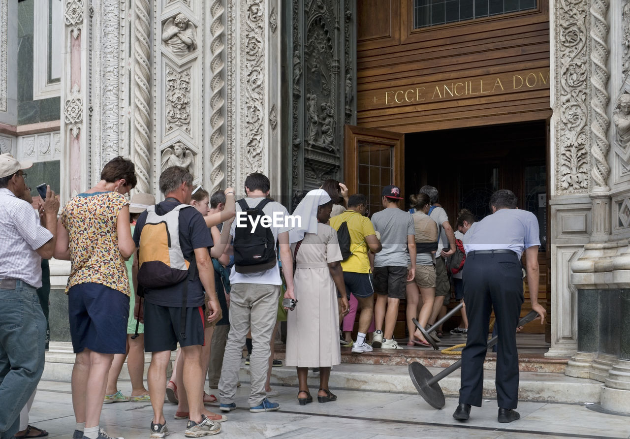 TOURISTS VISITING TEMPLE