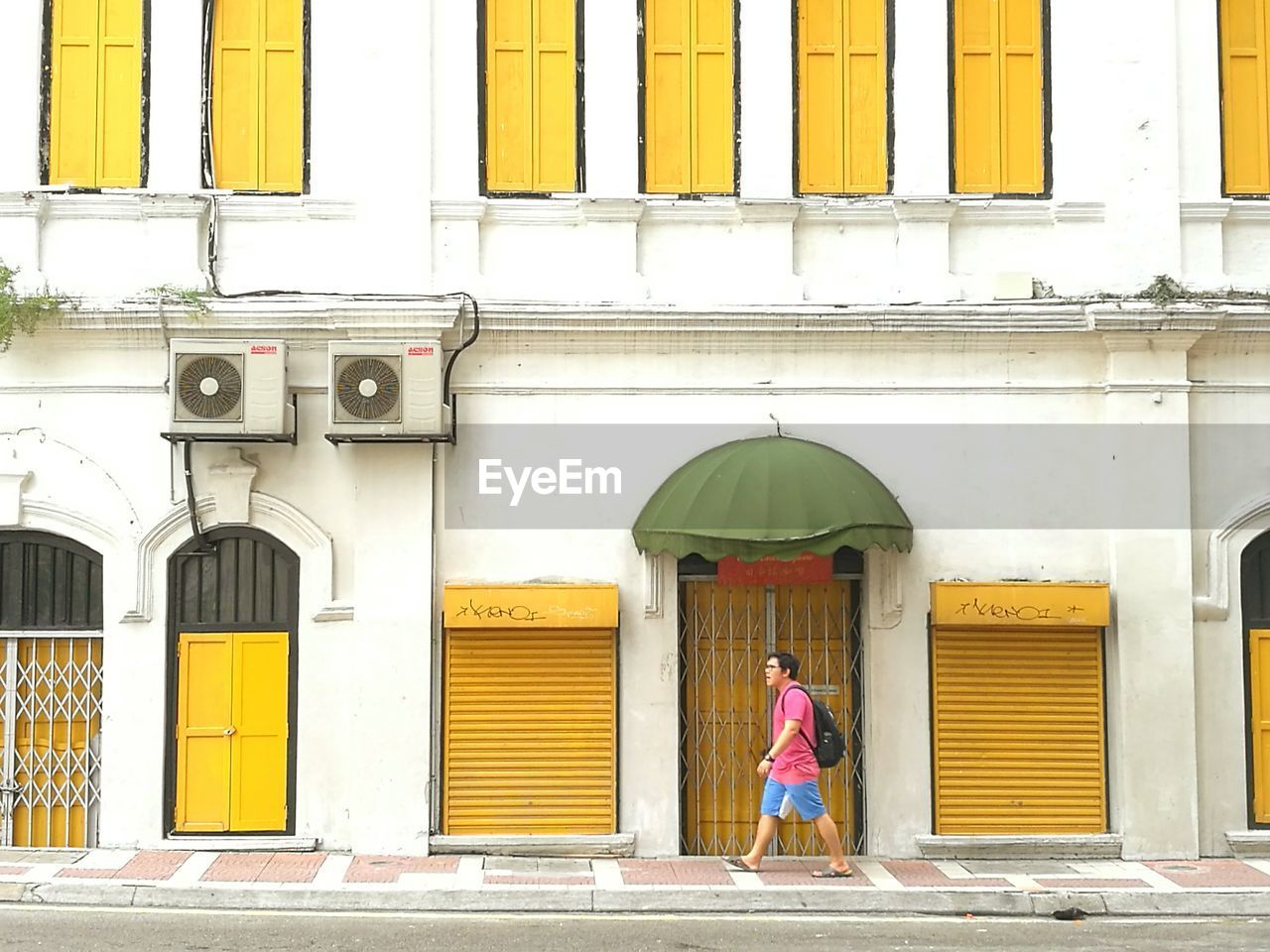 FULL LENGTH OF MAN WITH YELLOW DOOR