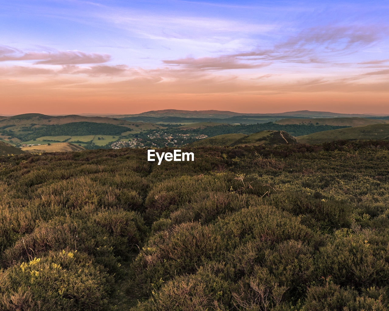 Scenic view of landscape against sky during sunset