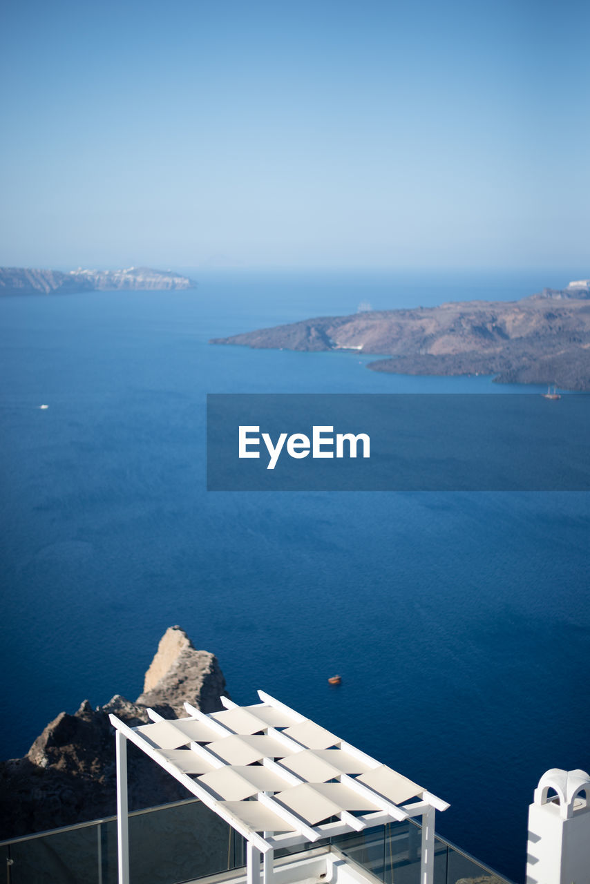 High angle view of bay against blue sky