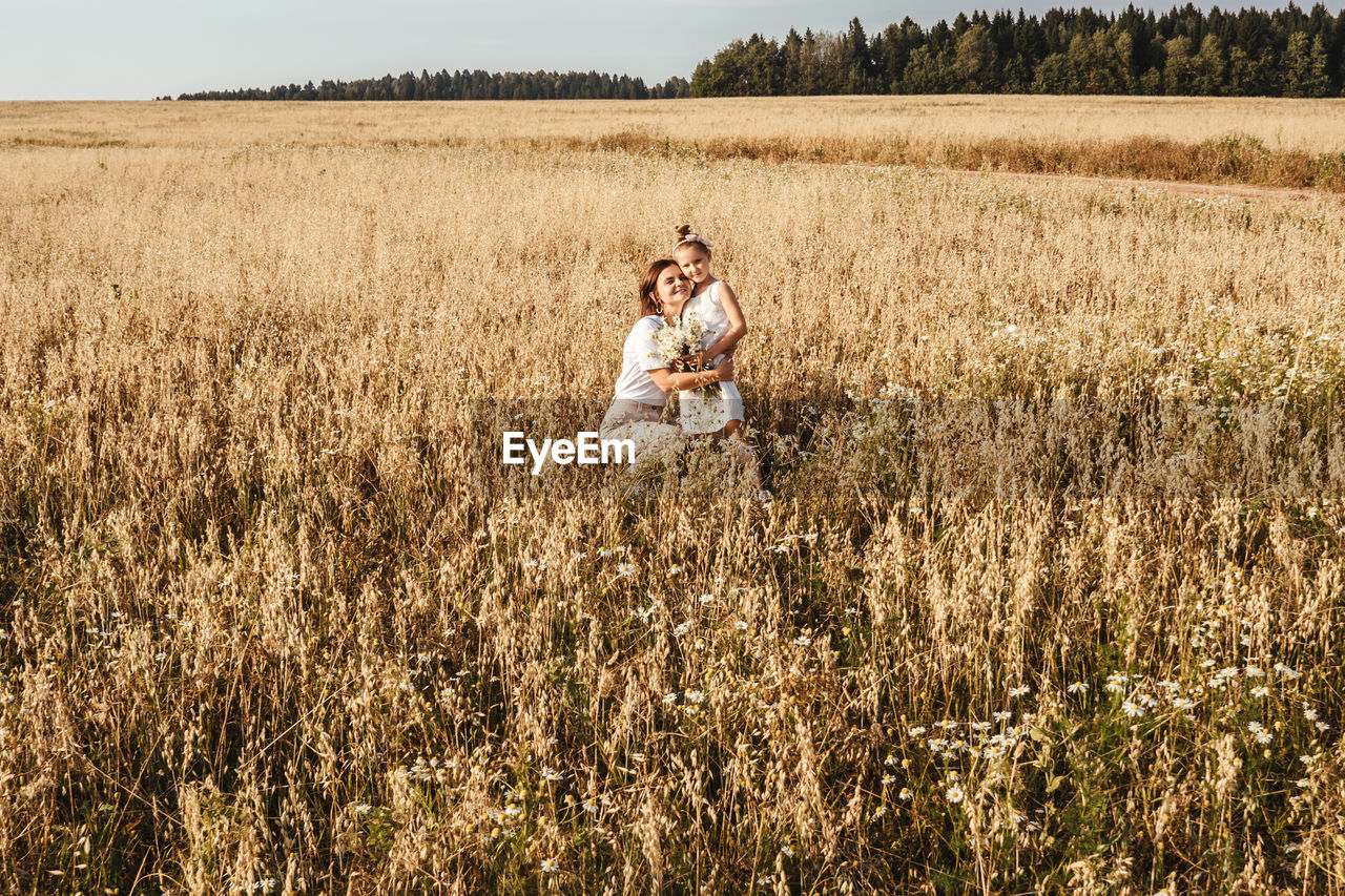 MAN AND WOMAN ON FIELD