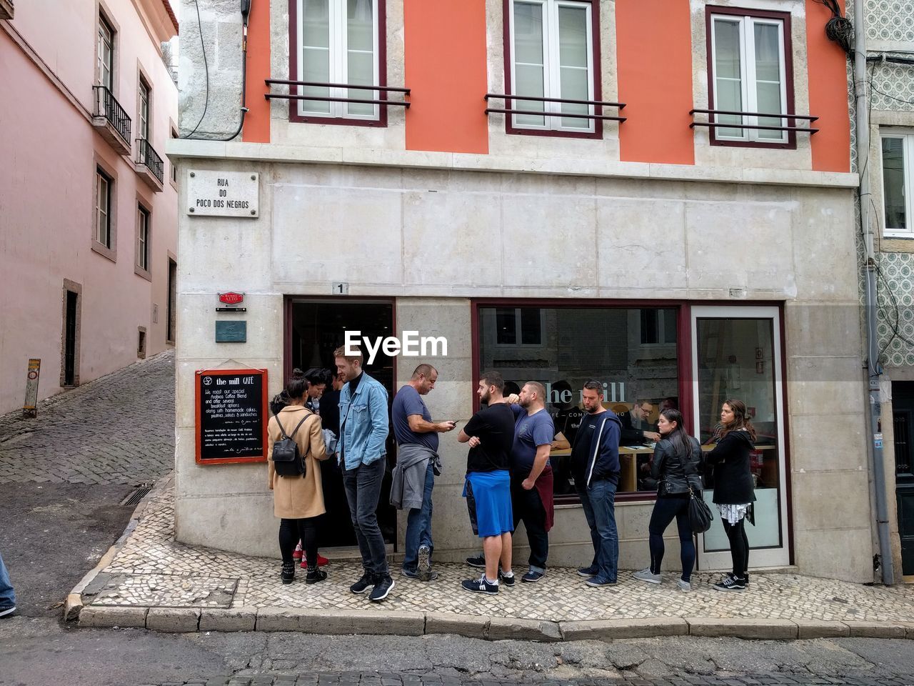 PEOPLE STANDING ON WALL