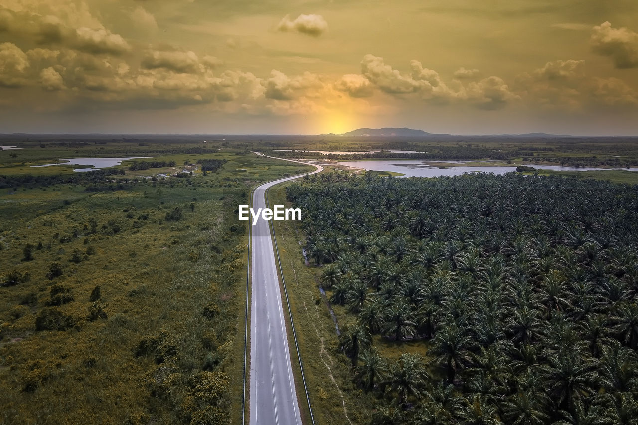 Scenic view of road against sky during sunset