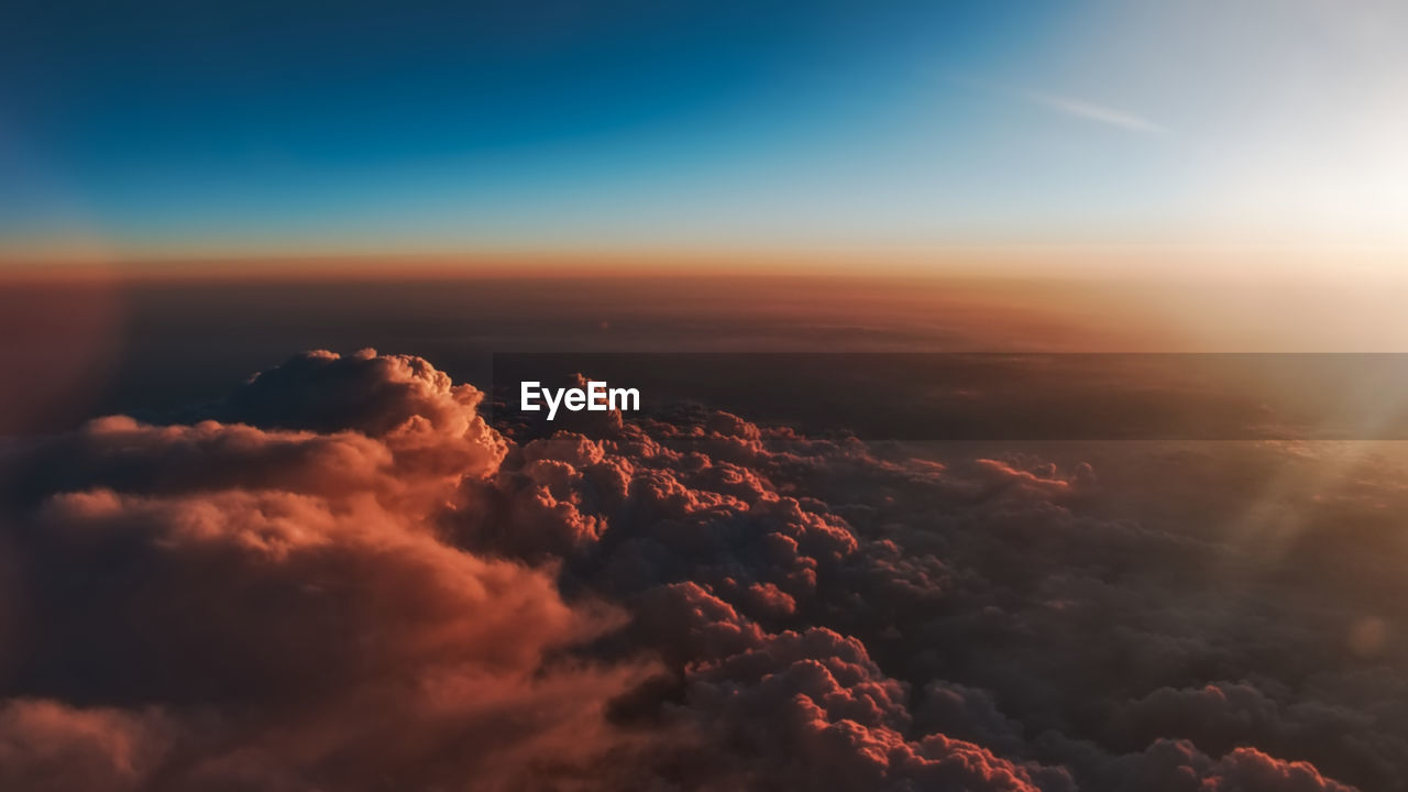 Aerial view of clouds in sky during sunset