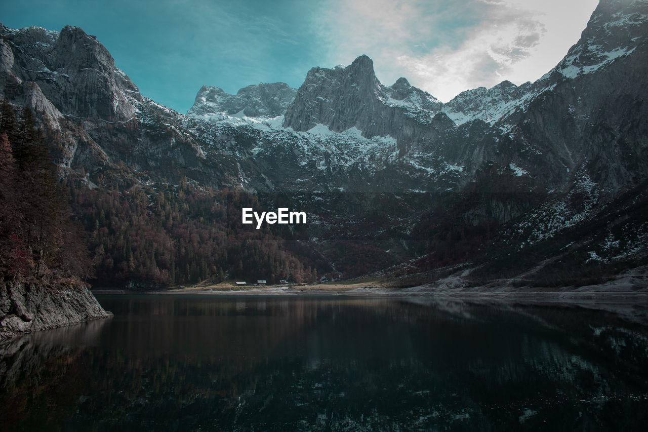 Scenic view of lake and mountains against sky