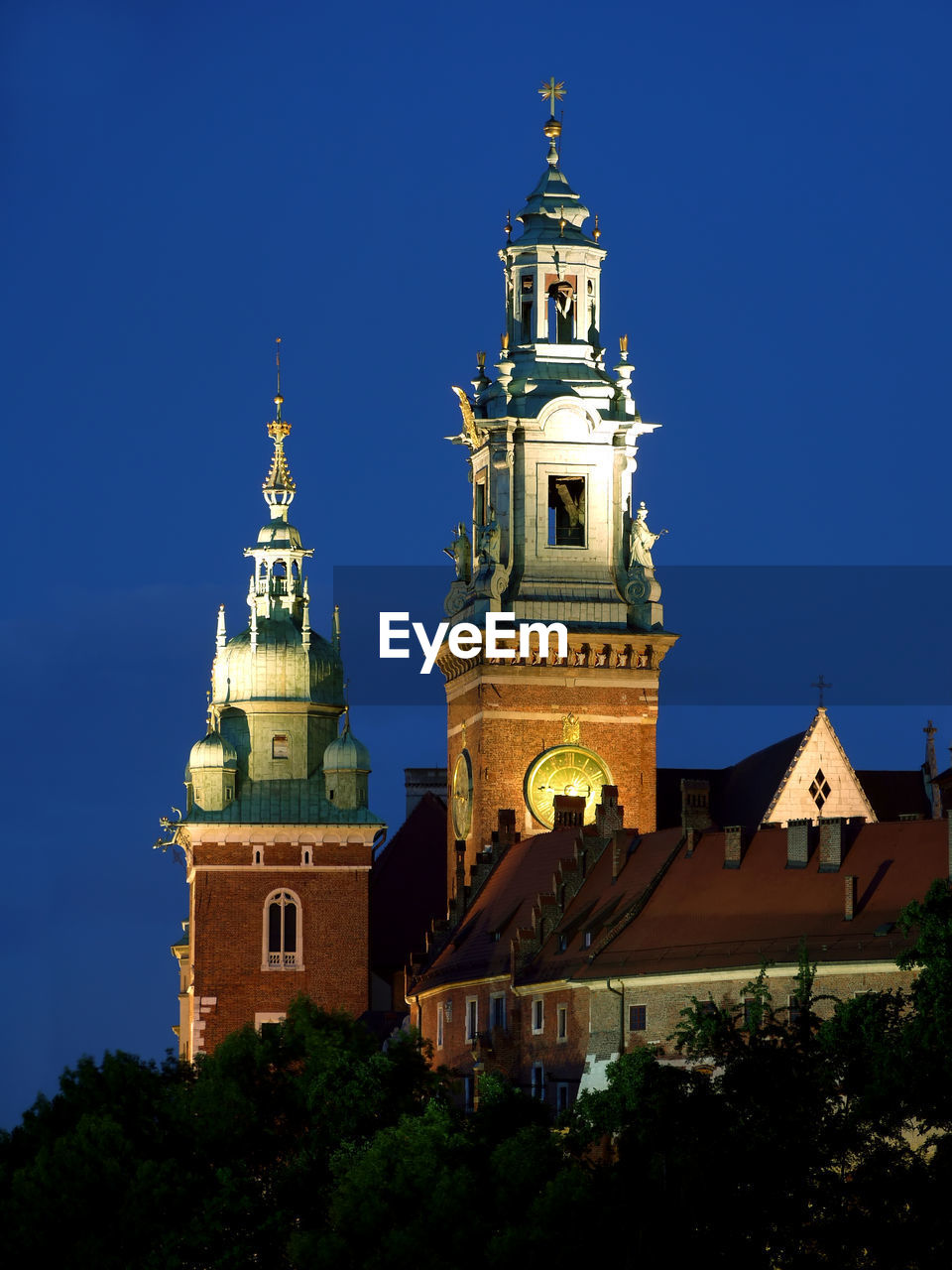 Royal wawel castle illuminated at night, krakow - poland