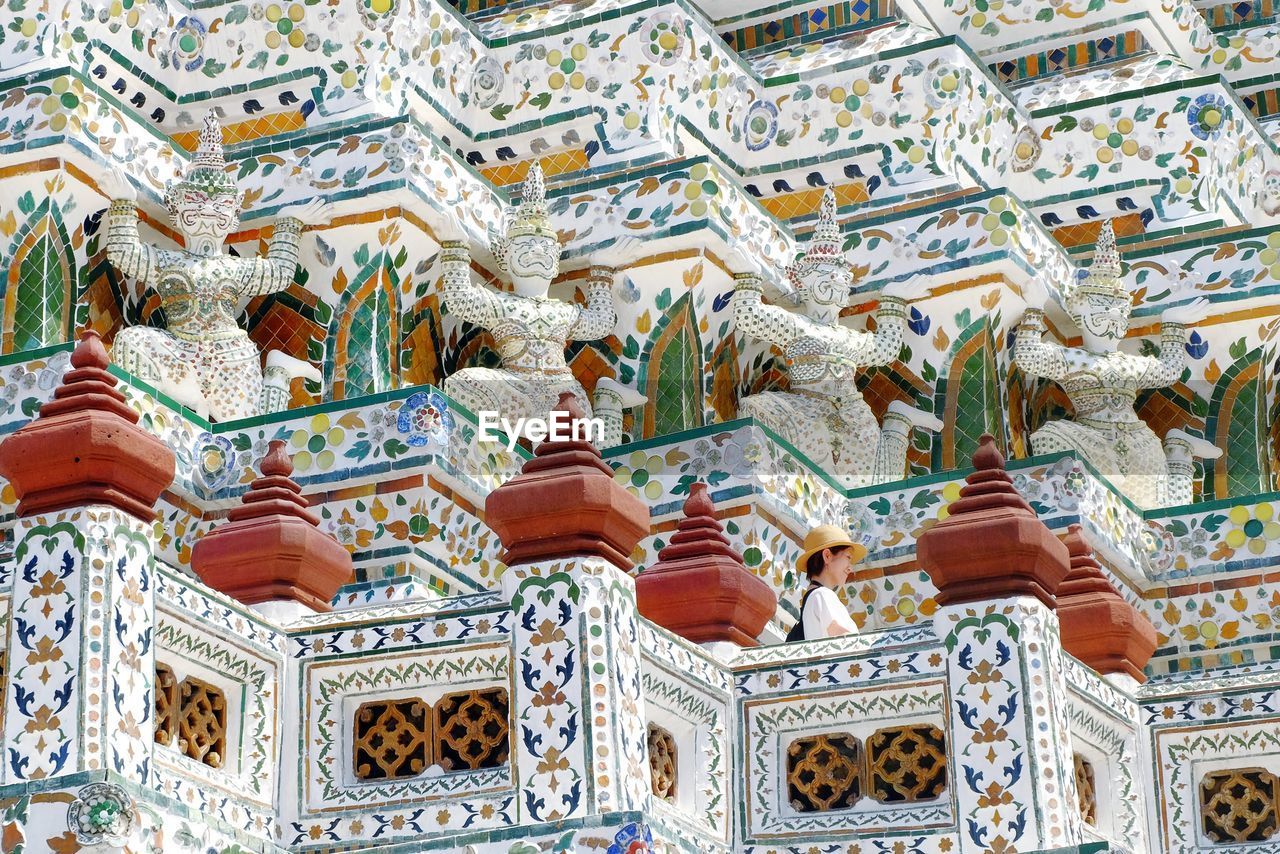 Low angle view of sculptures and ornate on temple