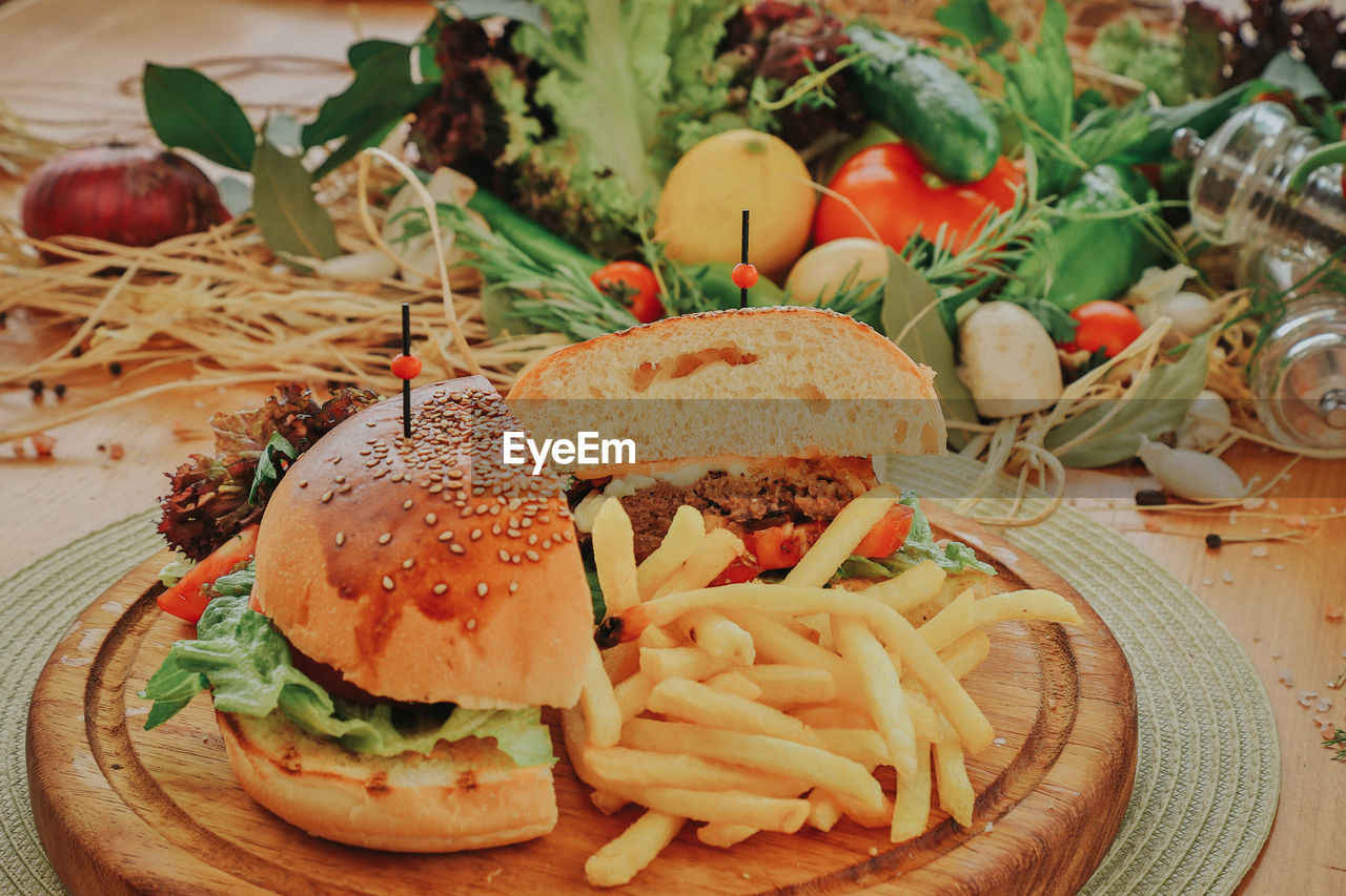 Close-up of burger and vegetables in plate