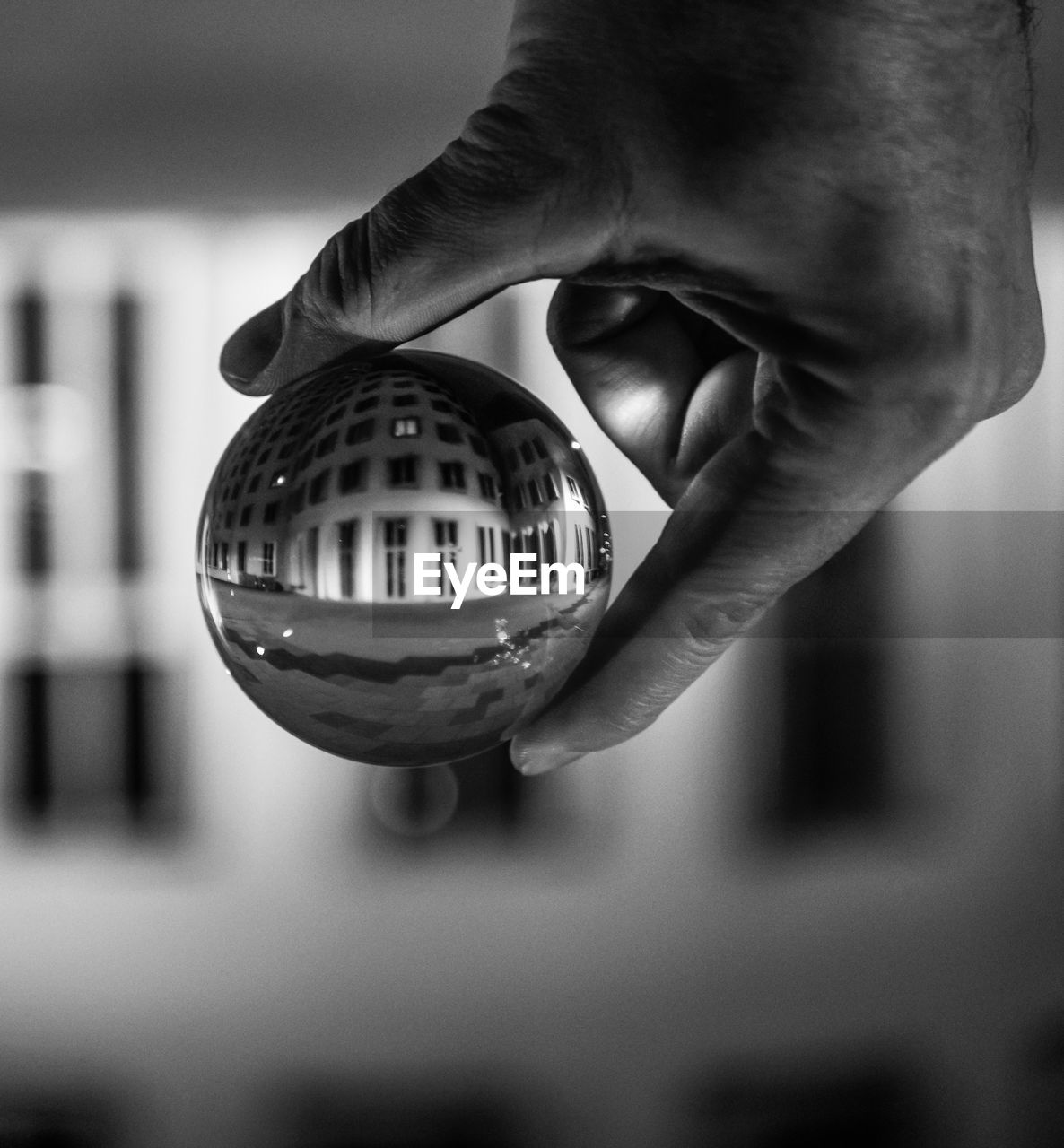 Close-up of person holding crystal ball