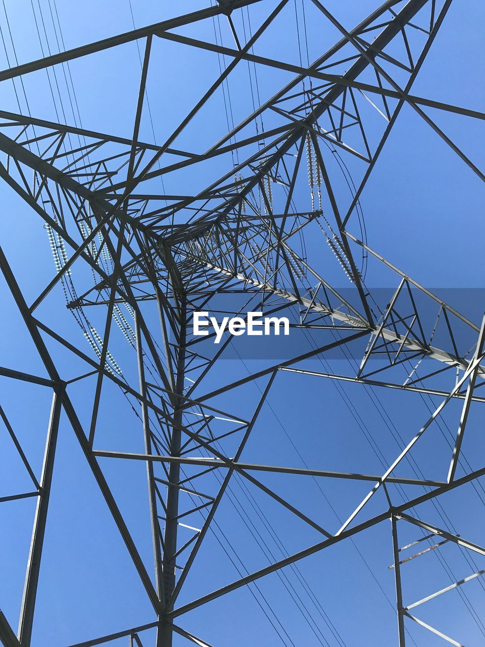 CLOSE-UP LOW ANGLE VIEW OF ELECTRICITY PYLON