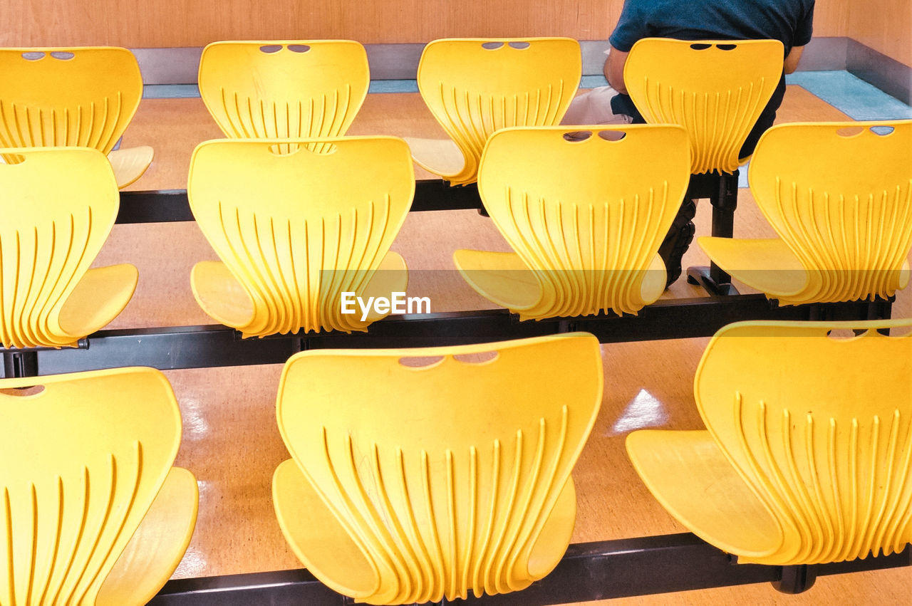 Close-up of yellow chairs in the waiting area