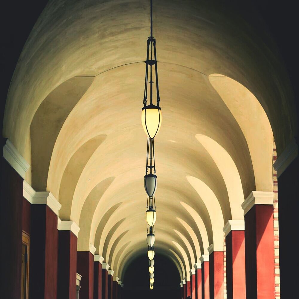 LOW ANGLE VIEW OF ILLUMINATED CEILING IN TUNNEL