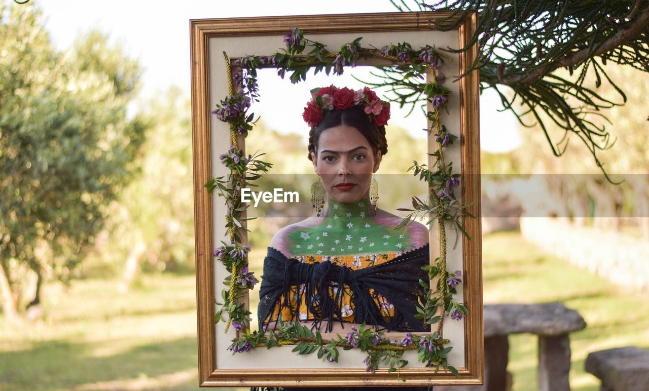 Portrait of woman wearing tiara seen through frame