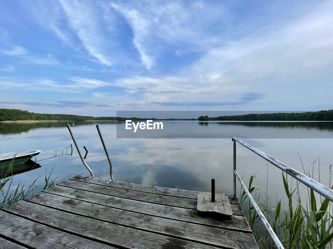 PIER ON LAKE AGAINST SKY